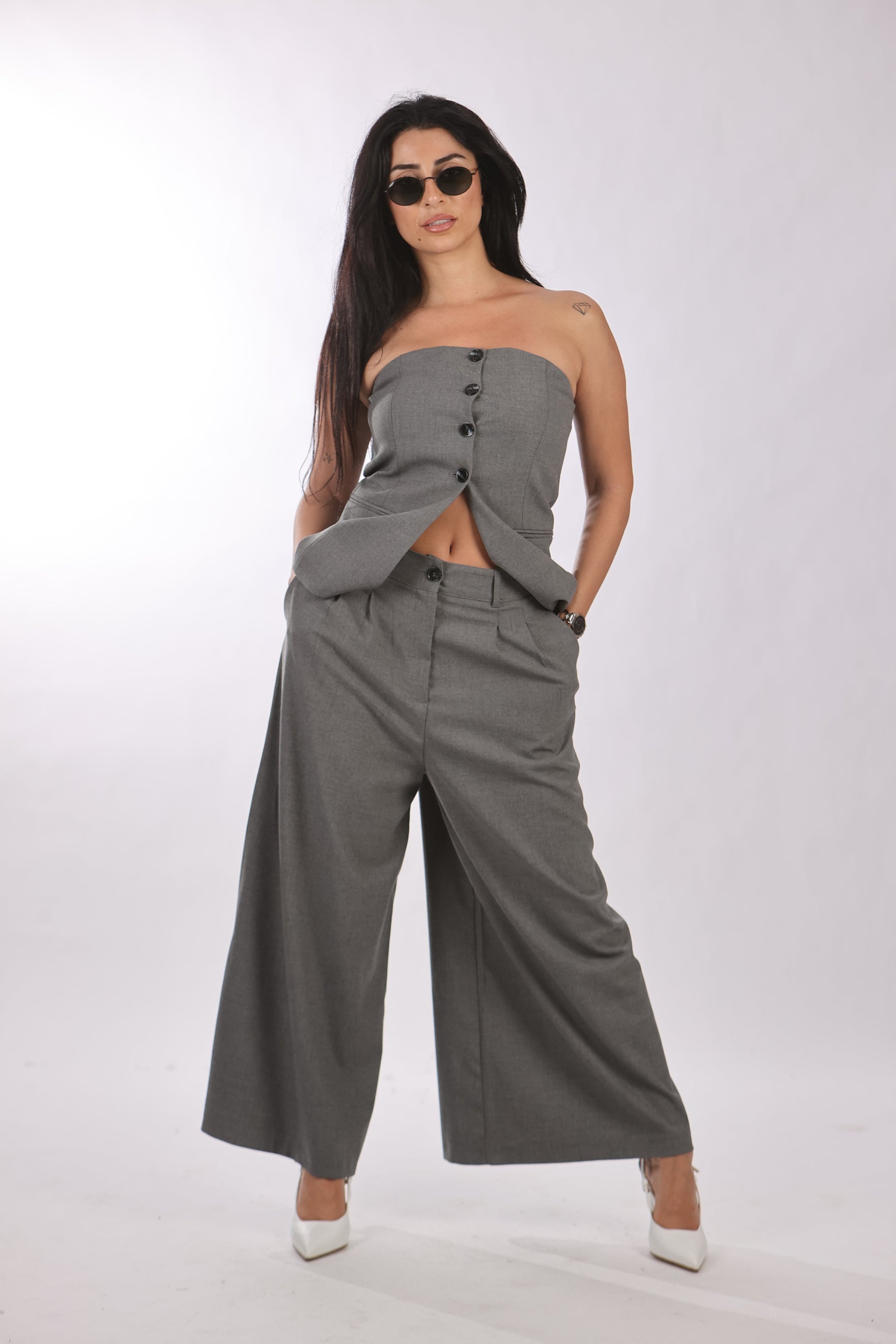 Quzu vest with buttoned-down front in gray, styled with matching wide-leg pants.